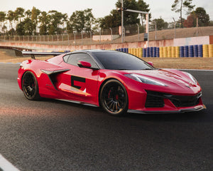 Side view of Corvette C8 Z06 ERAY ZR1 with carbon fiber spoiler on a race track
