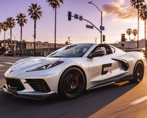 Silver C8 Corvette Stingray driving with 5VM style carbon fiber side skirts and underbody extensions