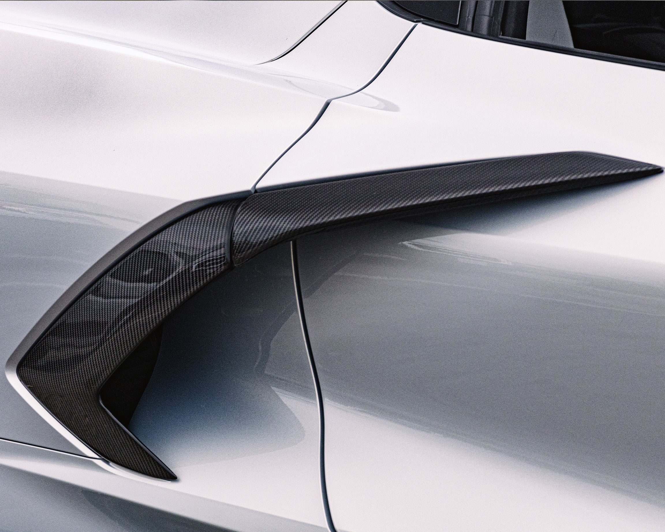 C8 Corvette carbon fiber rear side scoop boomerang trim and door handle cover installed