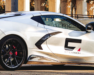 Silver C8 Corvette Stingray featuring carbon fiber side air intake boomerang trim