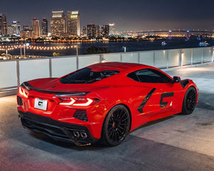 Red C8 Corvette coupe showing carbon fiber low profile rear spoiler and exterior trim