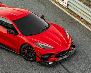 Top view of a Corvette C8 with carbon fiber splitter on the track.