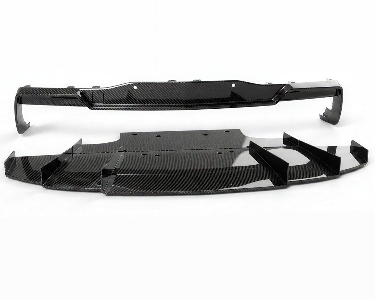 Uninstalled Corvette C8 Apex GT3 carbon fiber rear diffuser kit showing multi-piece assembly
