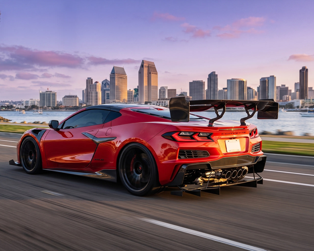 Track-tested Corvette C8 carbon fiber rear diffuser undertray showing side profile and ground clearance