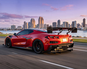 Track-tested Corvette C8 carbon fiber rear diffuser undertray showing side profile and ground clearance