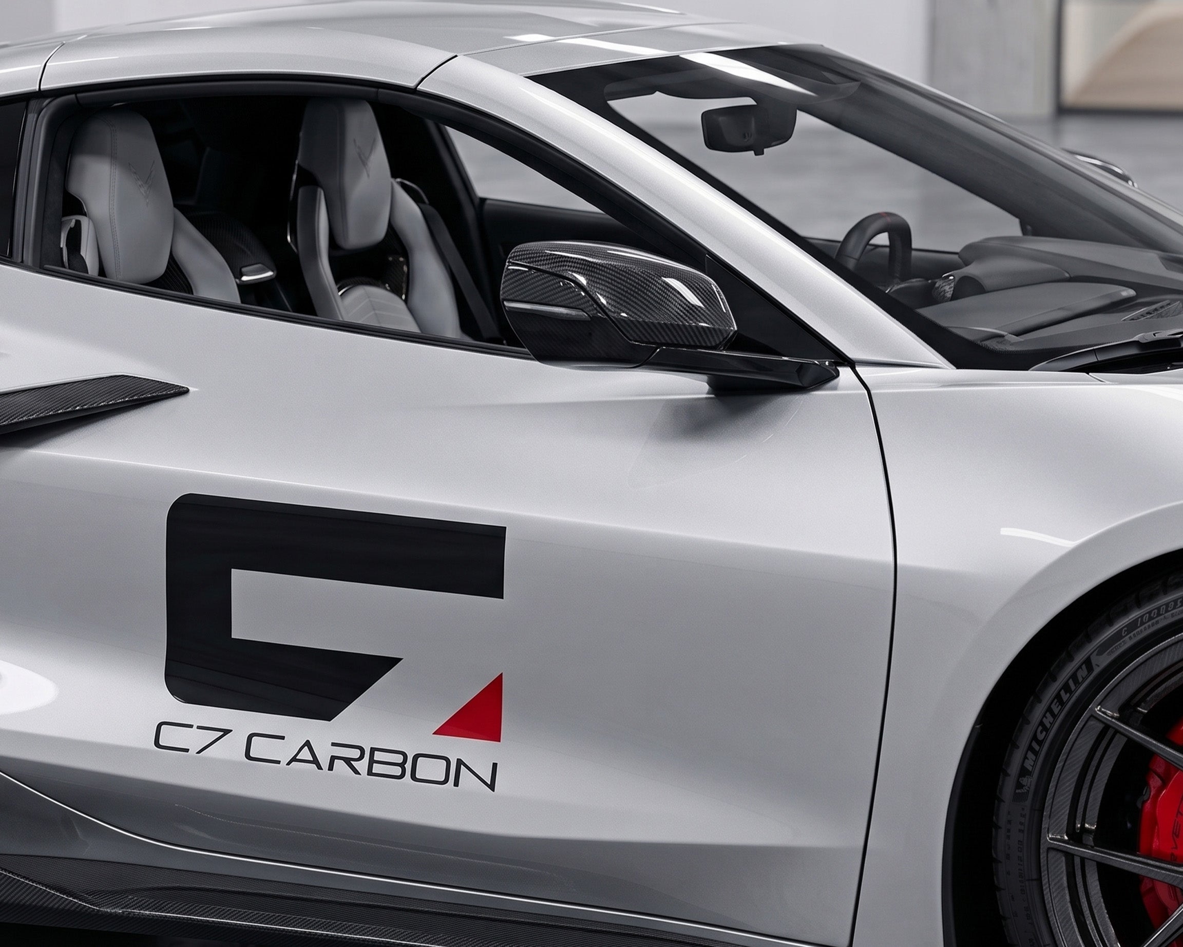 Silver C8 Corvette featuring C7 Carbon fiber mirror covers and side accents