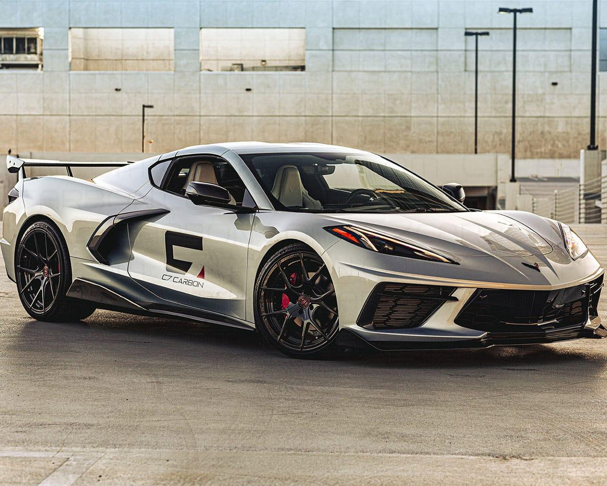 Front 3/4 angle view of C8 Corvette equipped with carbon fiber aero and high wing