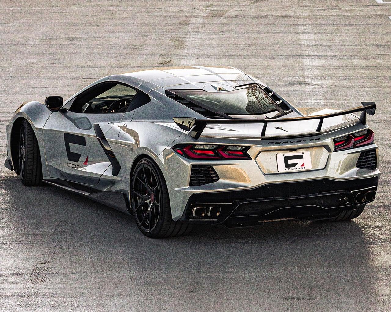 Rear three quarter view of C8 Corvette showing pre-preg carbon fiber OEM high wing spoiler