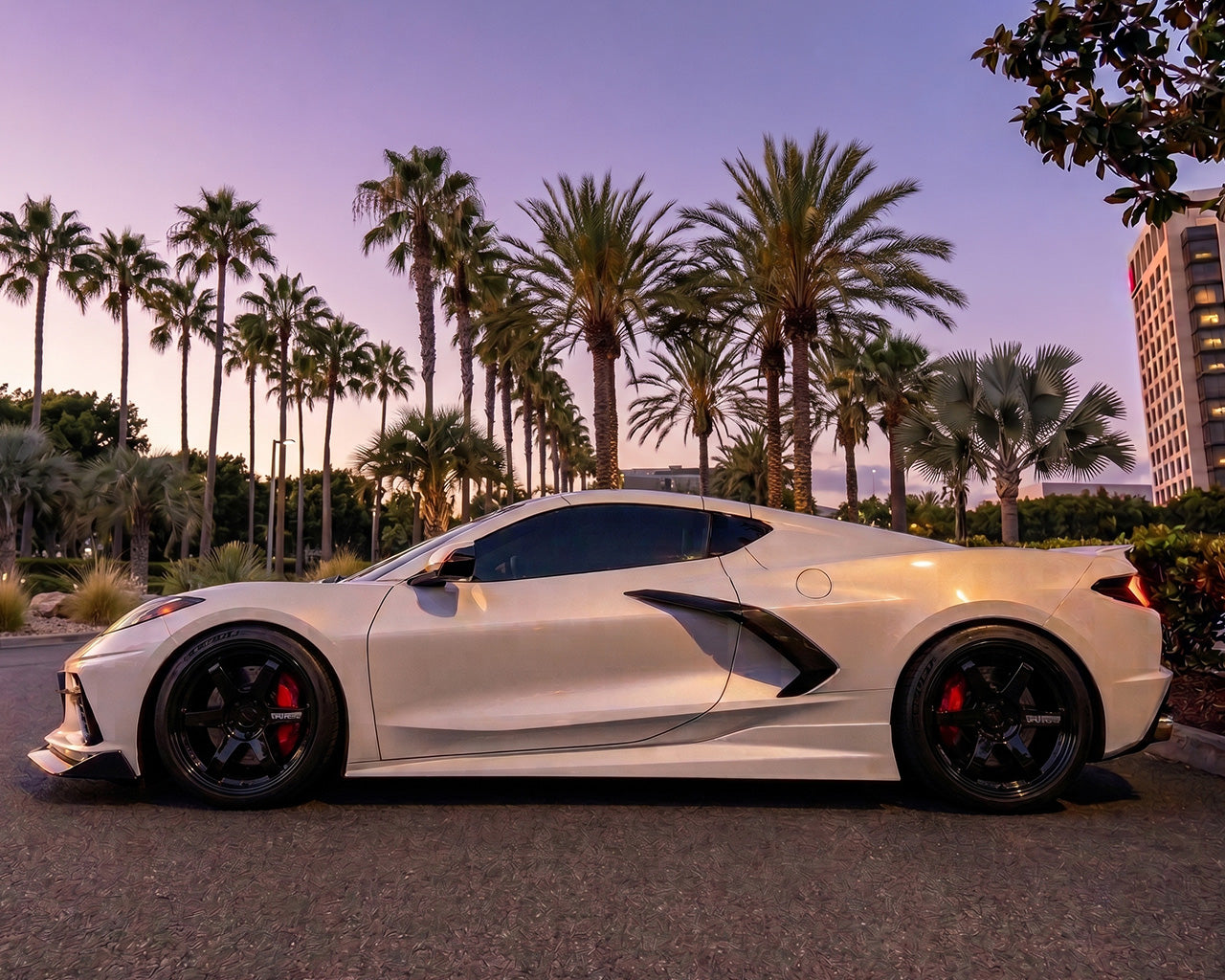 Side profile angle of white C8 Corvette Stingray with flush-mount carbon fiber Legacy side skirts
