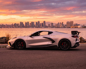 Full side silhouette view of white C8 Corvette featuring track aerodynamic Race Edition rear wing