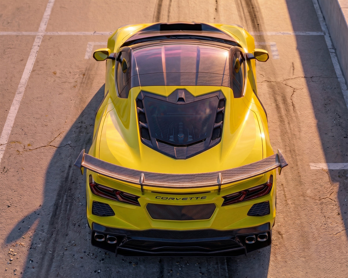 Direct overhead rear view of yellow C8 Corvette showing carbon fiber ZR1 style decklid spoiler