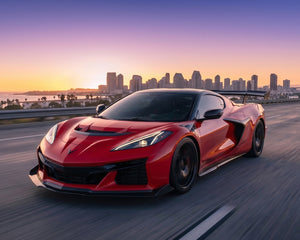 Sunset highway roller of red Corvette C8 Z06 ZR1 with extended underbody carbon fiber ground effects