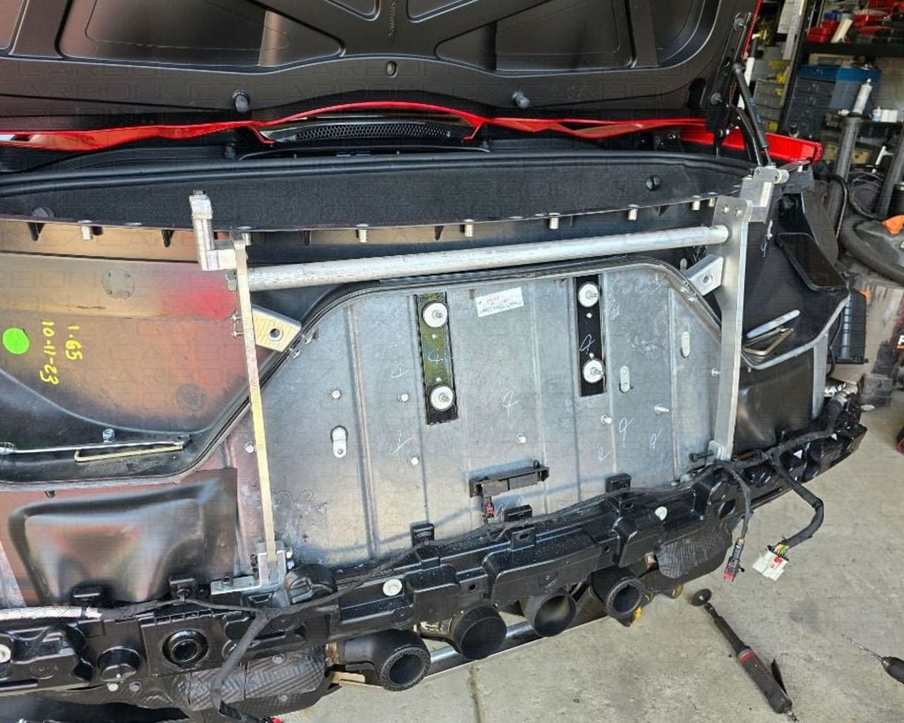 Rear bumper removed showing chassis mounting brackets for C8 Corvette Z07 high wing install