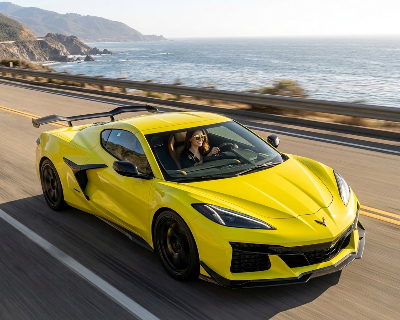Front three quarter view of yellow C8 Corvette Z06 equipped with carbon fiber Z07 track wing