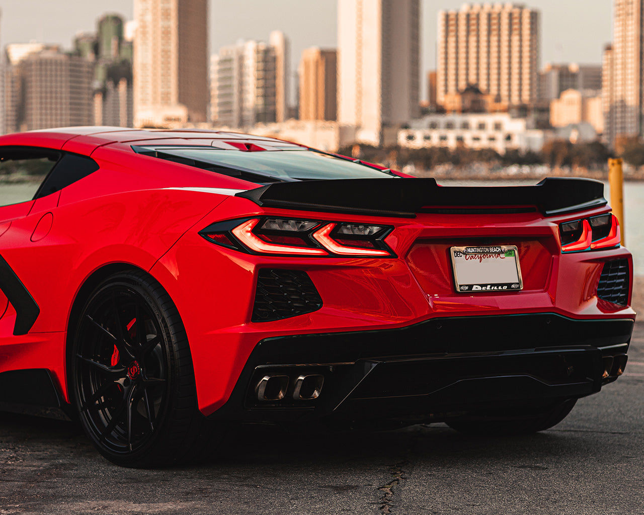 Red C8 Corvette Stingray with carbon fiber ducktail rear spoiler installed
