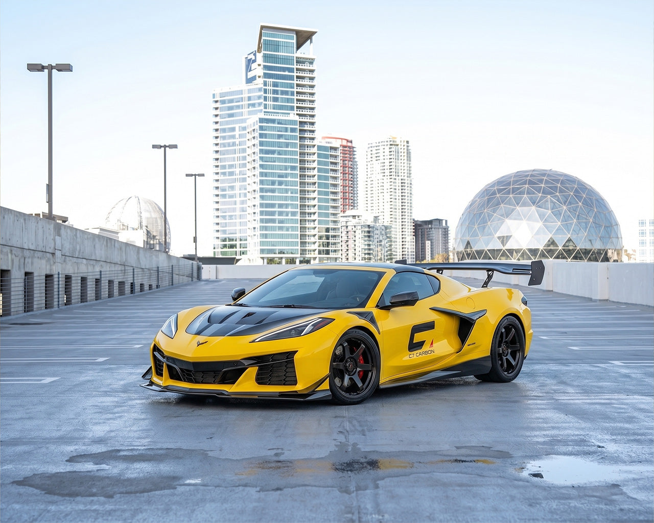 Accelerate Yellow C8 Corvette Z06 showing Carbon Fiber S-Duct Hood on City Rooftop