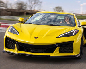 Front three quarter view of yellow C8 Corvette Z06 equipped with Z07-style front splitter without canard slots